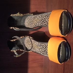 Orange and chitta pattern stilettos.